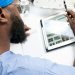 a man using a tablet, healthcare and ai, medical ai