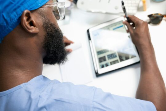 a man using a tablet, healthcare and ai, medical ai