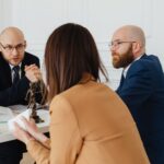 Brain injury lawyer (Professional discussion among lawyers in a modern office, focusing on legal matters.)